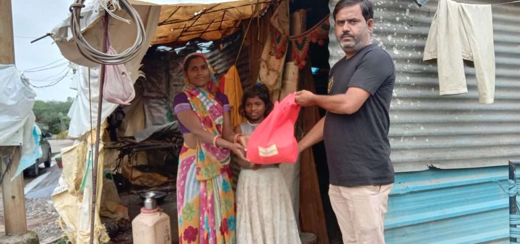 Distributing the Food Packets to the Needy slums